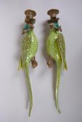A pair of polychrome porcelain and gilt metal parrot candle sconces, 47cm long
