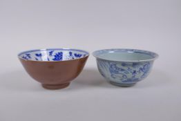 A Chinese blue and white rice bowl decorated with boys flying kites, and a copper glazed rice bowl
