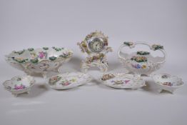 A collection of late C19th/early C20th Dresden porcelain, including a desk clock, trinket dishes,