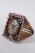 An Edwardian silver cased travelling clock, the dial with enamelled Arabic numbers and gilt