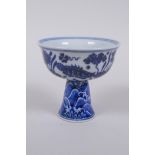 A Chinese blue and white porcelain stem cup decorated with carp in a lotus pond, Xuande 6