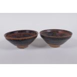 A pair of Chinese Cizhou kiln tea bowls, 10 cm diameter