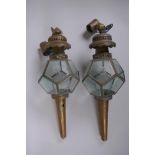 A pair of antique brass and glass polyhedral wall lanterns, 52cm long