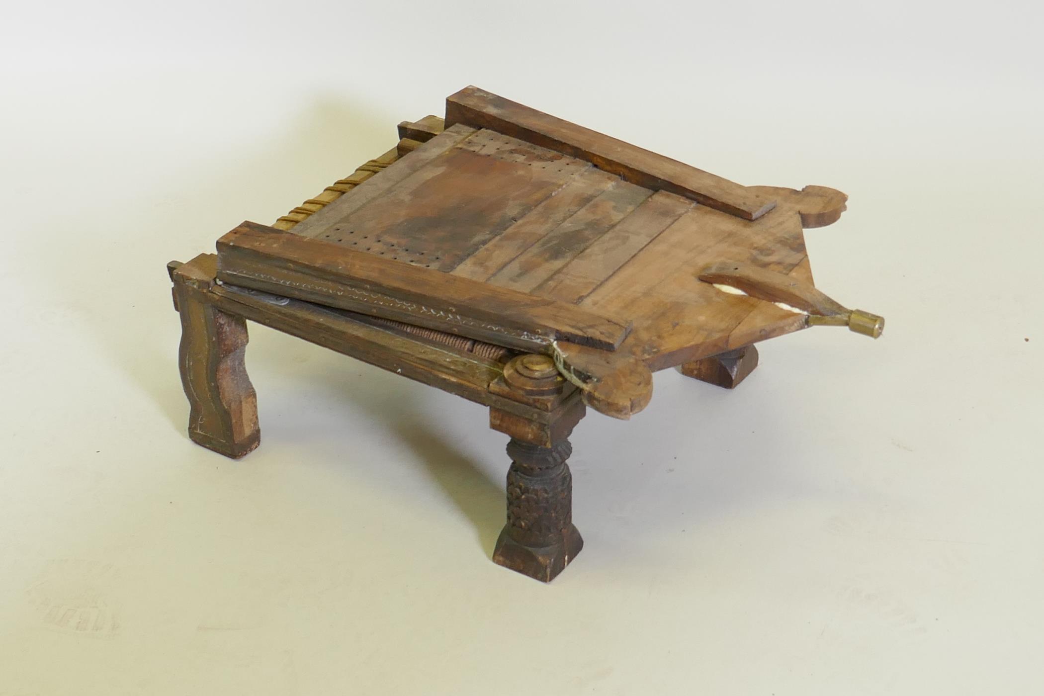 An antique Indian Pidha low chair with folding back, brass and iron mounts and webbed seat - Image 4 of 4