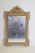 A C19th French giltwood and composition wall mirror with pierced crest decoration, 68 x 108cm