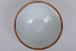A Chinese Song style celadon glazed porcelain dish of conical form, with underglaze decoration of