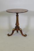 A Regency rosewood wine table, with parcel gilt decoration, raised on a carved and fluted column and