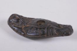 An antique Syrian carved hardstone figural oil lamp, 12cm long
