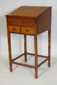 An antique parquetry inlaid child's bureau, with two drawers and a fitted interior, adapted, 44 x