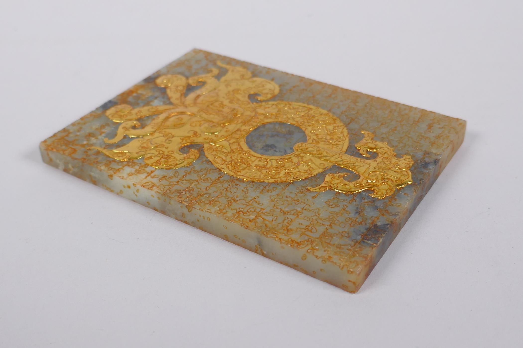 A Chinese carved celadon jade tablet with archaic style gilt decoration, 9 x 12cm - Image 3 of 3