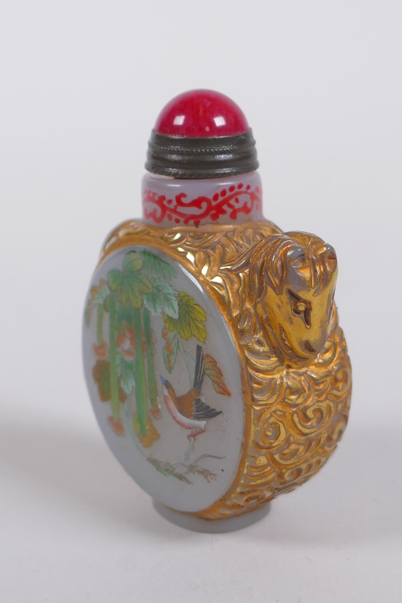A Peking glass snuff bottle with carved and gilt horse decoration, the side panels with polychrome - Image 2 of 4