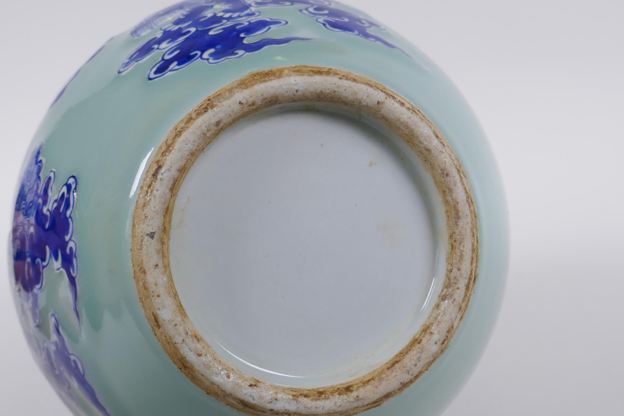 A Chinese celadon ground porcelain bottle vase with raised blue and white kylin decoration, 35cm - Image 6 of 6