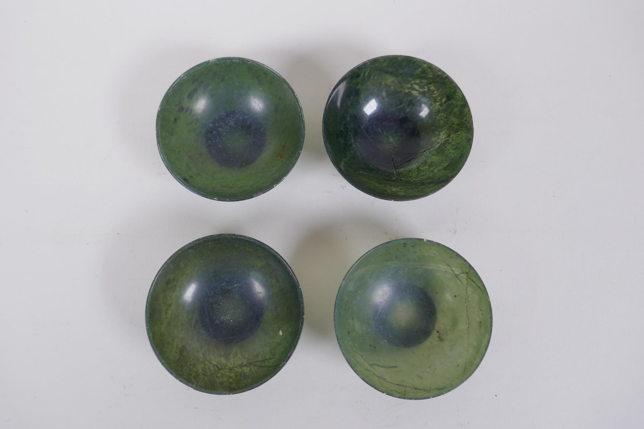 Four Chinese spinach jade bowls, AF repairs, 7cm diameter - Image 2 of 8