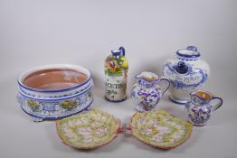 A collection of Italian Majolica to include a vinegar bottle, bramble wine jug, a tureen with