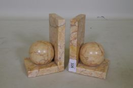 A pair of marble bookends, 15cm high