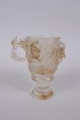 A Chinese moulded glass libation cup with kylin decoration, 10cm high