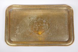 A Persian brass tray with chased decoration depicting Shah Abbas with an attendant, 53 x 32cm