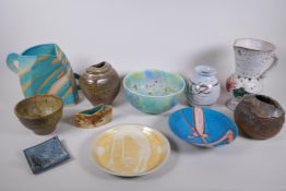 A collection of eleven studio pottery pieces, including a Vivienne Ross plate and a Hugh West studio