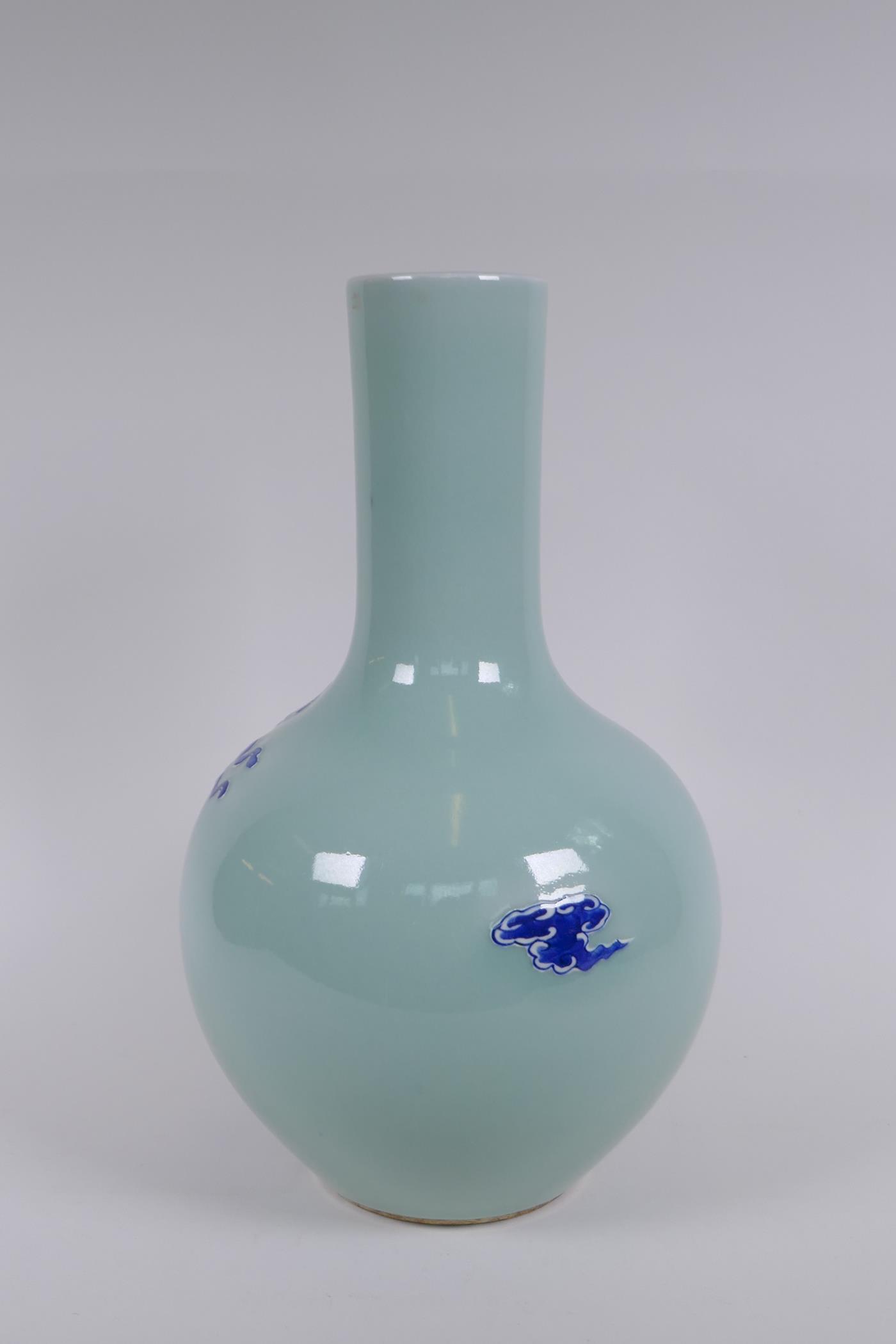A Chinese celadon ground porcelain bottle vase with raised blue and white kylin decoration, 35cm - Image 3 of 6