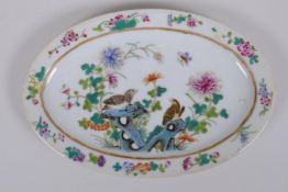 A polychrome porcelain oval dish decorated with birds amongst flowers, Chinese GuangXu 6 character