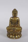 A Sino Tibetan filled bronze Buddha, double vajra mark to base, 11cm high