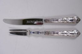 A set of six silver handled tea knives and a matching set of cake forks by Harrison Brothers,