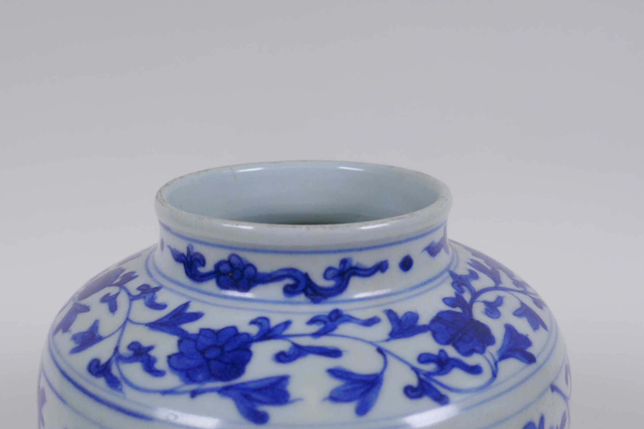 A Chinese blue and white porcelain jar with scrolling lotus flower decoration, 17cm high - Image 4 of 5