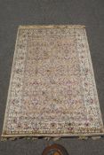 A gold ground full pile Kashmir rug with floral medallion design, 156 x 230cm