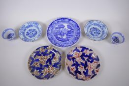 A pair of late C19th/early C20th Chinese blue and white bowls with floral decoration, a pair of blue