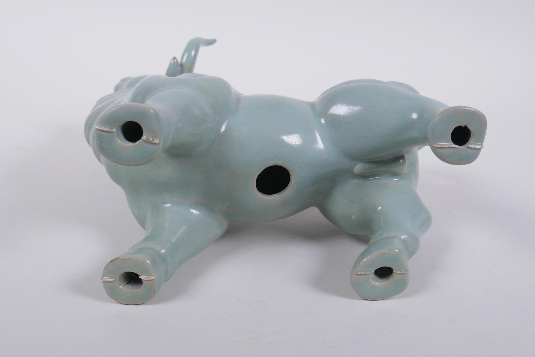 A Chinese celadon glazed porcelain figure of a buffalo, AF repair, 22cm long - Image 5 of 5