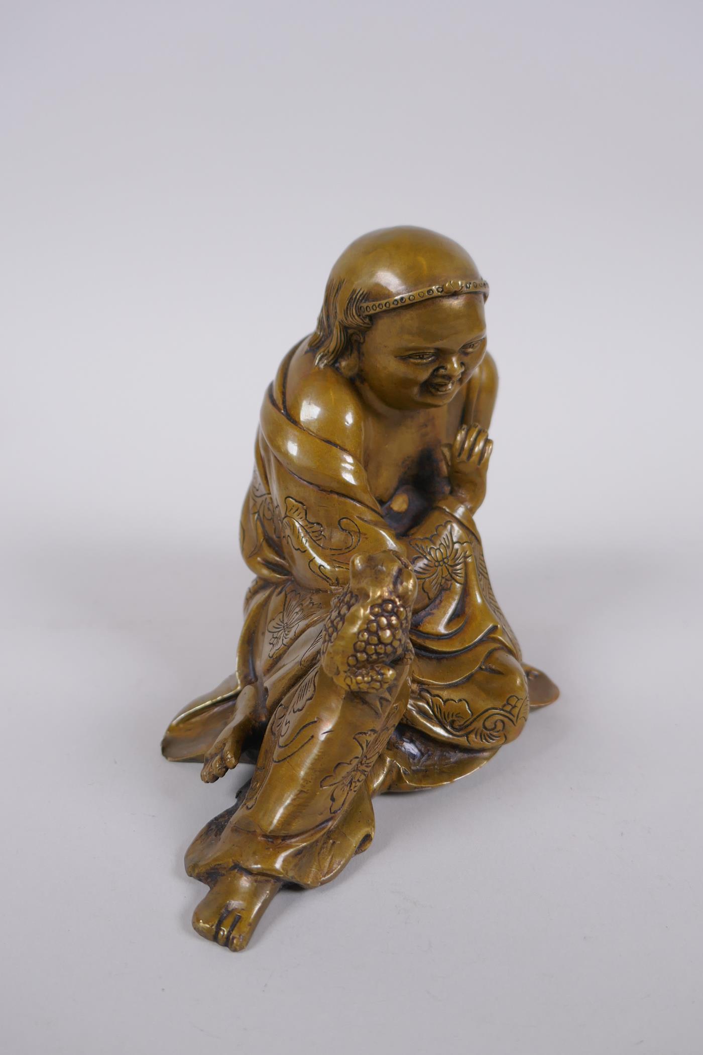 A Chinese filled bronze figure of Lo-han, 18cm long - Image 2 of 4