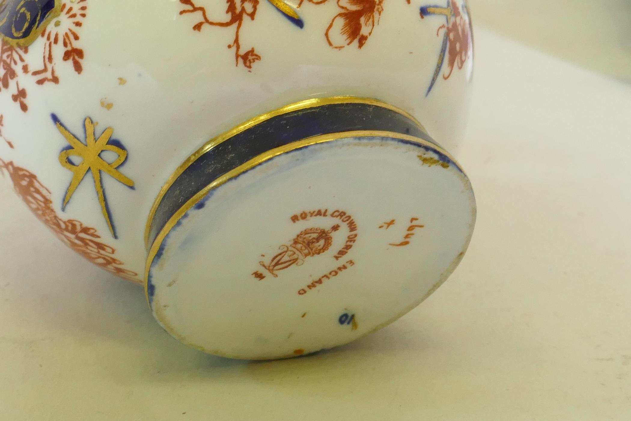 A Royal Crown Derby porcelain vase with gilt highlights on a green ground and hand painted - Image 4 of 9