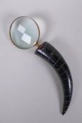 A horn handled brass mounted magnifying glass, 32cm long