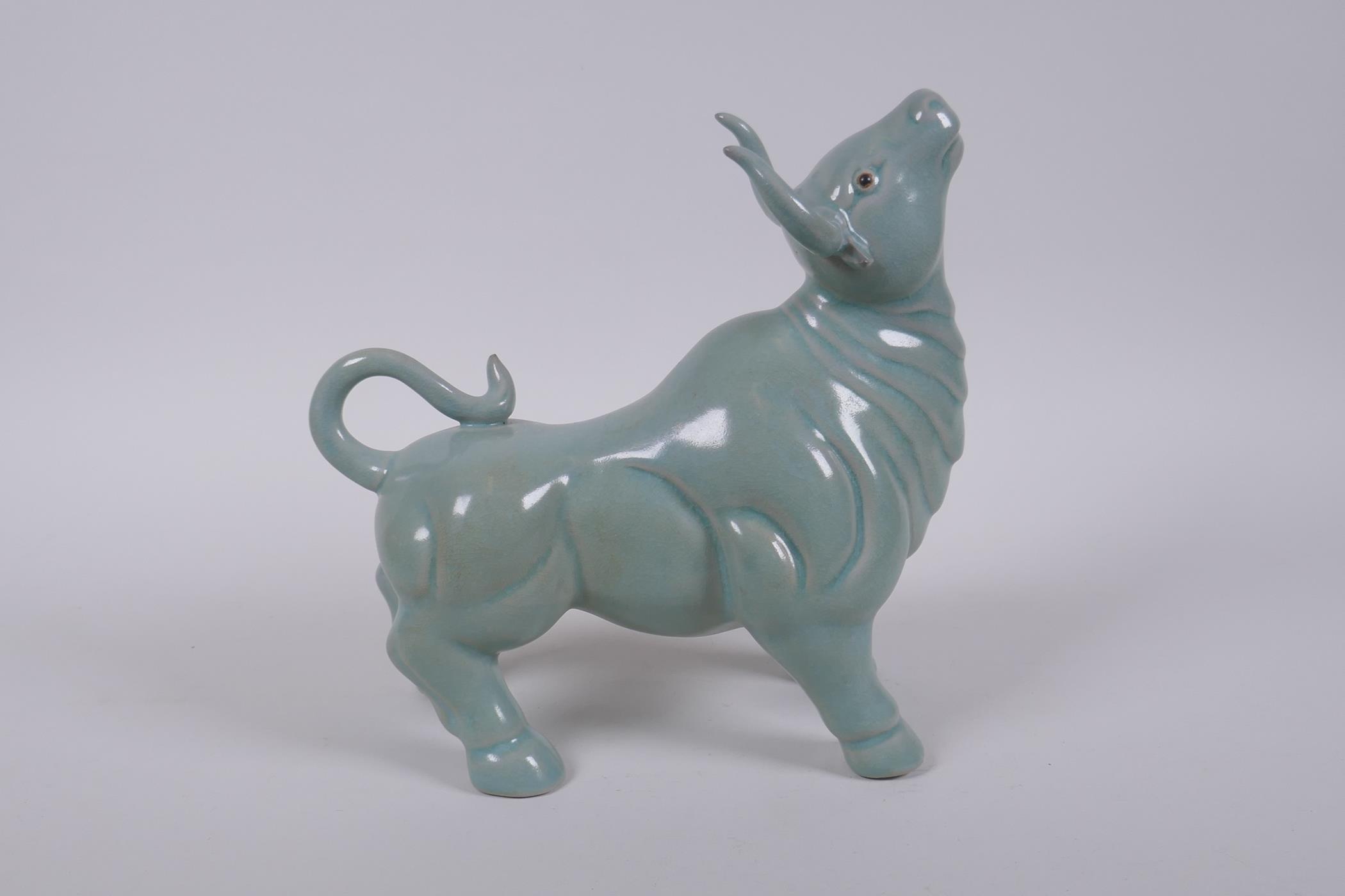 A Chinese celadon glazed porcelain figure of a buffalo, AF repair, 22cm long - Image 3 of 5