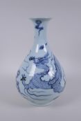 A Chinese blue and white porcelain pear shaped vase, decorated with a dragon in flight, 32cm high