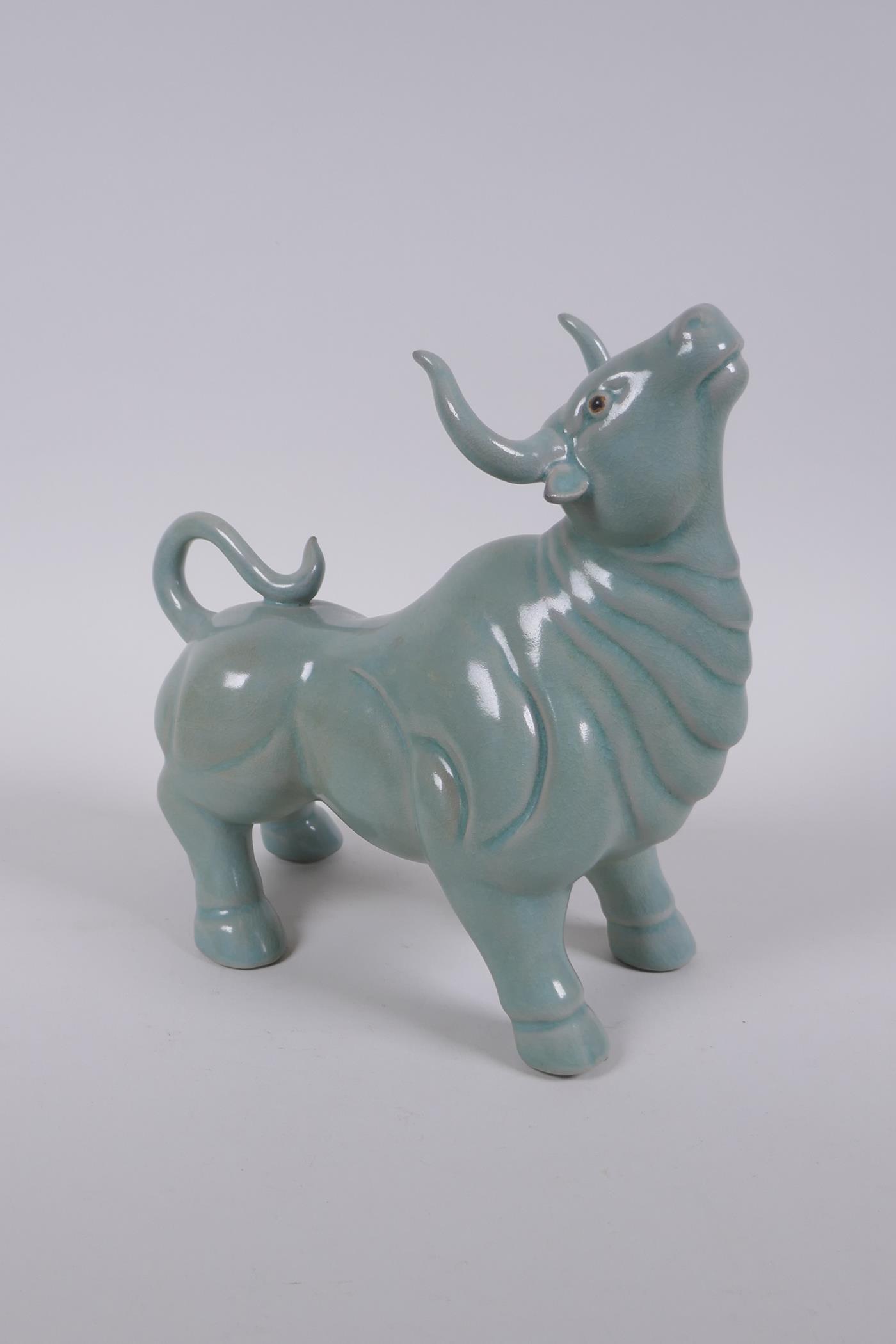 A Chinese celadon glazed porcelain figure of a buffalo, AF repair, 22cm long - Image 2 of 5