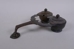 An antique Persian bronze two section smoker's set/accessory, 25 x 17cm