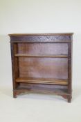 A C19th oak open bookcase with carved frieze, 107 x 25cm, 113cm high