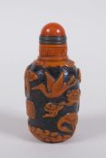 A Chinese Peking glass snuff bottle with raised decoration of crane and bats in a landscape, 7cm