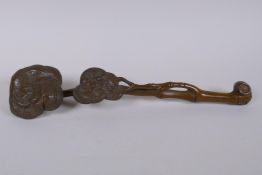 A Chinese carved boxwood ruyi, 35cm long