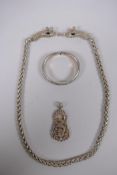 A Chinese white metal chain link necklace with twin dragon head clasp, a similar pendant and a