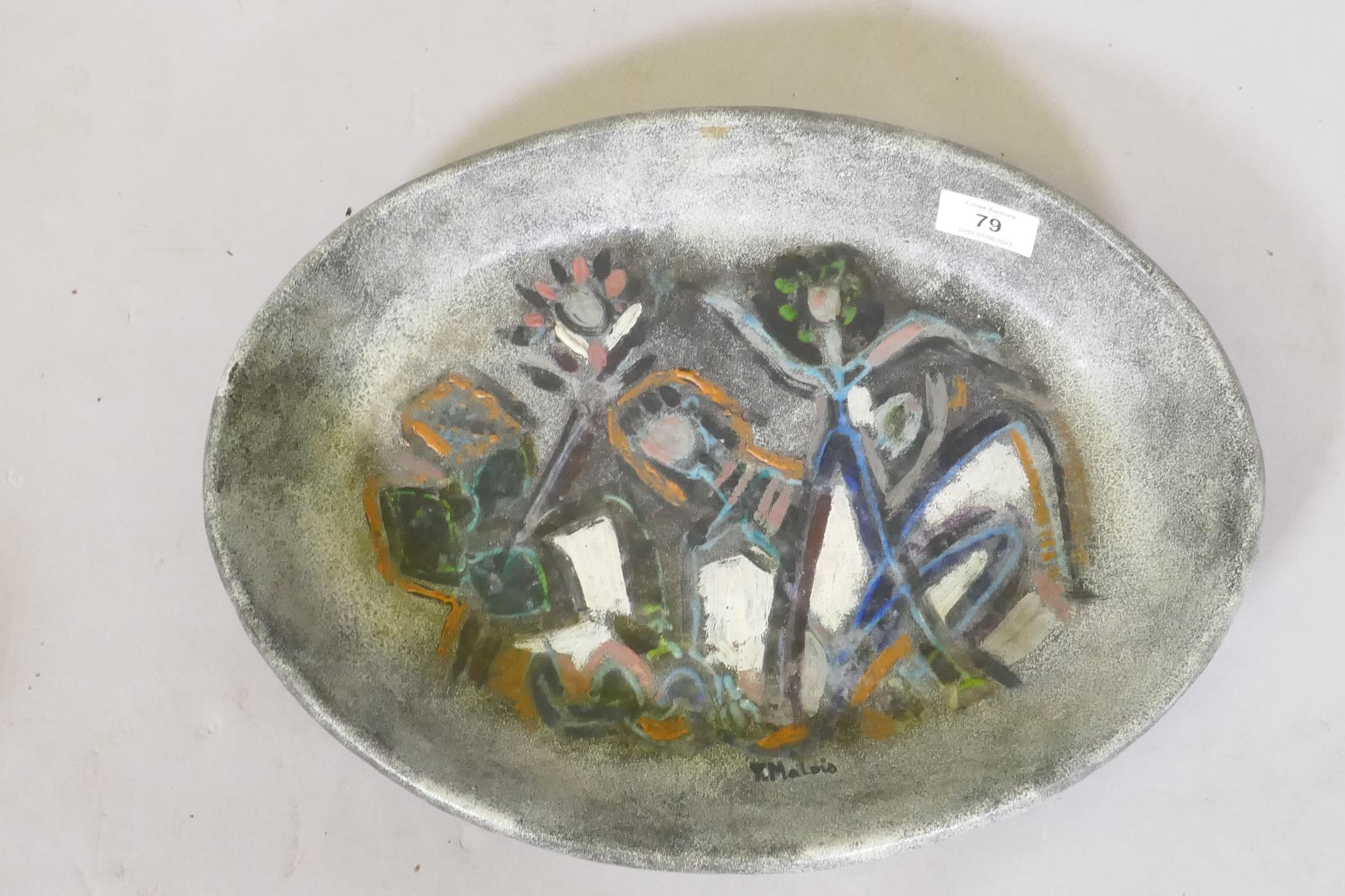 A studio pottery bowl with hand painted decoration, signed T. Malois, the base inscribed Accolay,