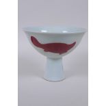 A Chinese red and white porcelain stem bowl with carp decoration, Xuande 6 character mark to base,