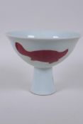 A Chinese red and white porcelain stem bowl with carp decoration, Xuande 6 character mark to base,