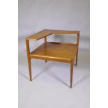 A mid century teak two tier occasional table in the manner of Peter Hvidt, 66 x 61 x 63cm high