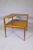 A mid century teak two tier occasional table in the manner of Peter Hvidt, 66 x 61 x 63cm high