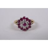 An 18ct yellow gold diamond and ruby ring, size N/O