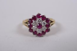 An 18ct yellow gold diamond and ruby ring, size N/O