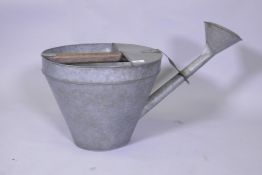 A vintage galvanised watering can, 39cm high