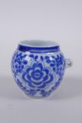A blue and white porcelain bird feeder with scrolling floral decoration, Chinese KangXi 4